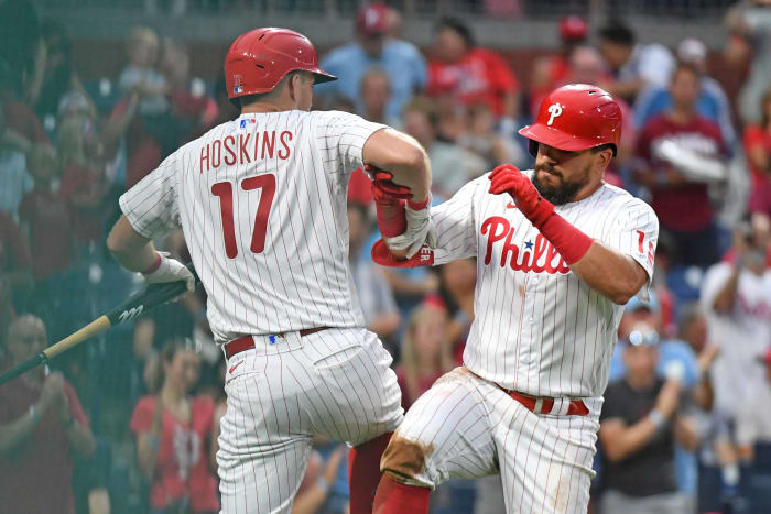 Kyle Schwarber celebrates with Rhys Hoskins at home plate following his home run against the Washington Nationals.